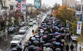 (تصاویر) کاروان اربعین در تهران زیر باران 